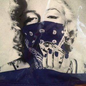 Blue and white mask with Marilyn Manroe on it